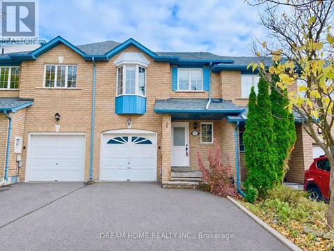 A two-story house with a blue garage door.