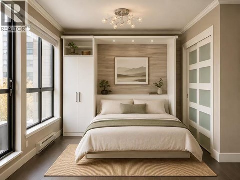 A bedroom with a bed, a rug, and a picture on the wall.