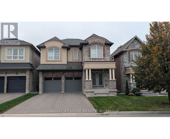 A large, multi-level house with a garage is for sale.