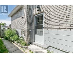 A house with a grey door and a grey wall.