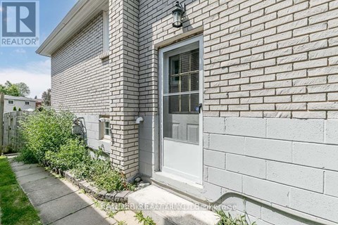 A house with a grey door and a grey wall.