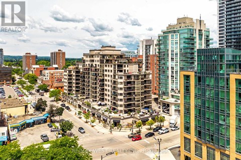 A city street with cars and buildings.