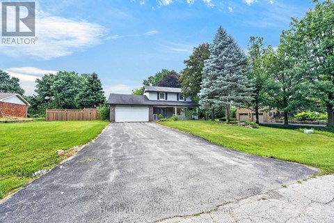 A house with a driveway in front of it.