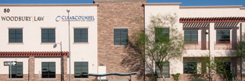 A building with a sign that says Woodbury Law.