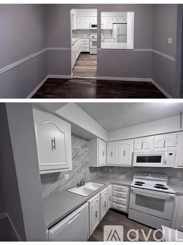 A kitchen with white cabinets and appliances is available for rent.