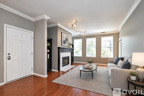 A living room with a fireplace and a couch.