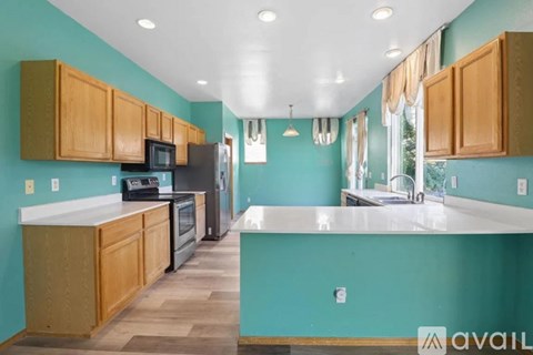 A kitchen with wooden cabinets and a white countertop.