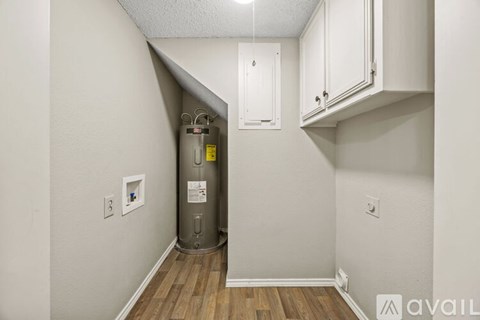 A room with a water heater installed in the corner.