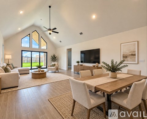 A modern dining room with a wooden table and chairs.
