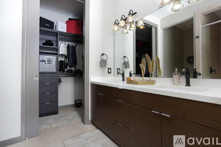 A bathroom with a vanity and a mirror.