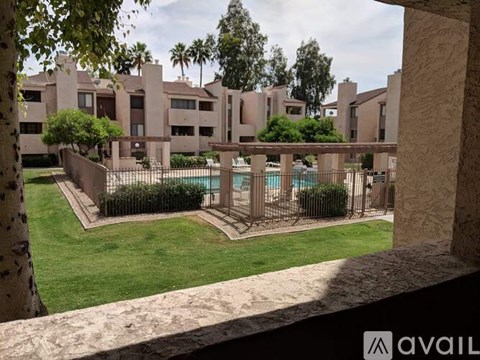 A building with a pool in the courtyard.