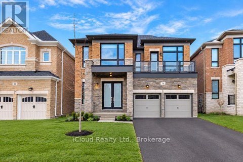 A large, modern house with a driveway in front.
