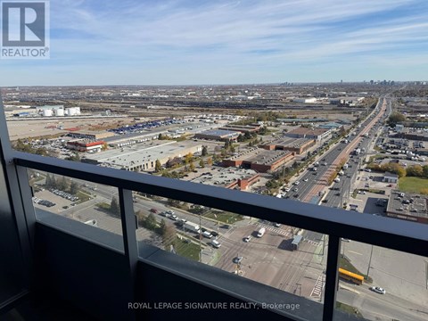 A view from a high vantage point looking down at a busy intersection and surrounding buildings.