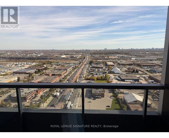 A view from a high vantage point overlooking a sprawling urban landscape with a clear sky.