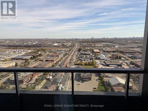 A view from a high vantage point overlooking a sprawling urban landscape with a clear sky.