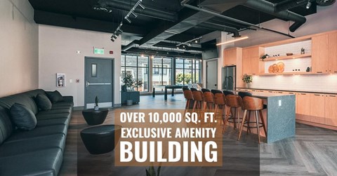 A modern living room with a kitchen area and a text overlay stating "OVER 10,000 SQ. FT. EXCLUSIVE AMENITY BUILDING".