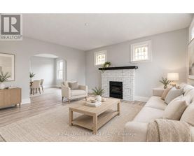 A living room with a fireplace and a couch.