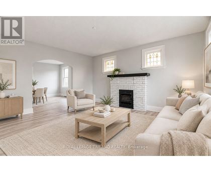 A living room with a fireplace and a couch.