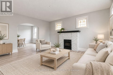 A living room with a fireplace and a couch.