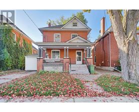 A house with a red brick exterior and a white door.