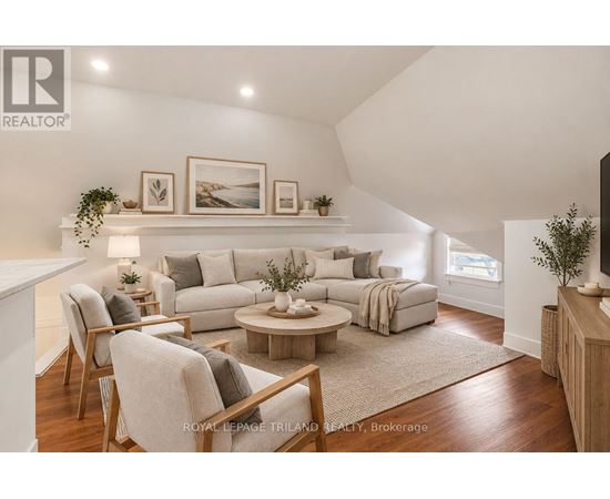 A living room with a grey sofa and a coffee table.