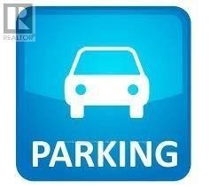 A blue parking sign with a white car symbol.