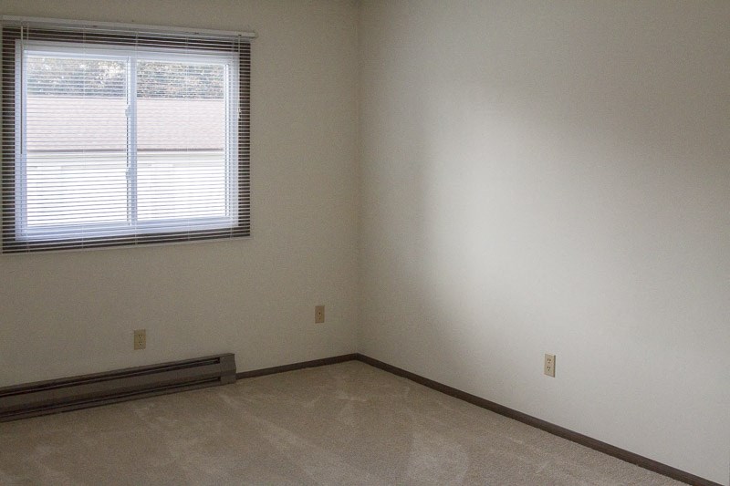 an empty room with a window and