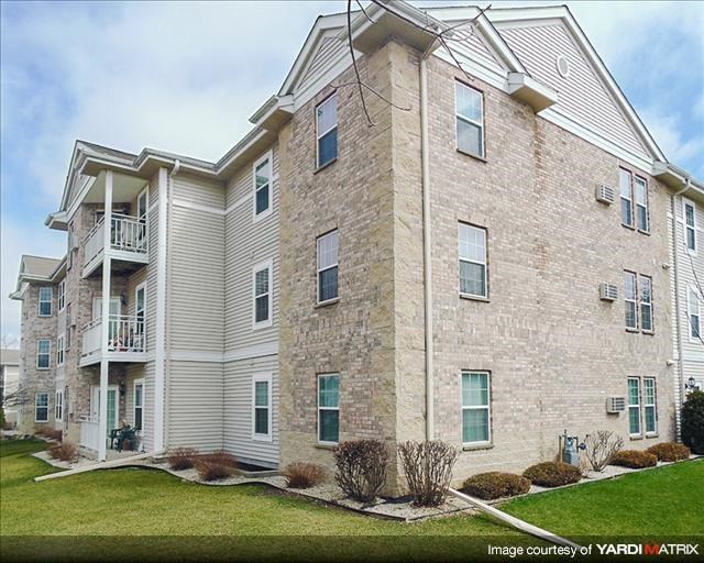 a brick building with a balcony on the side of it