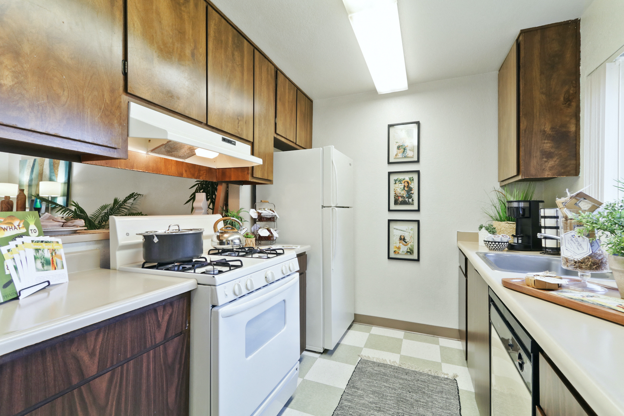 a kitchen with white appliances and wooden cabinets