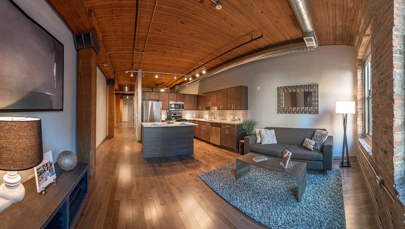 Chicago luxury apartment with exposed brick and beams in a loft