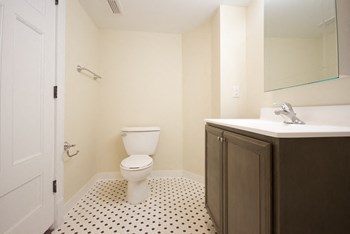 Bathroom with upgraded tiles and cabinets