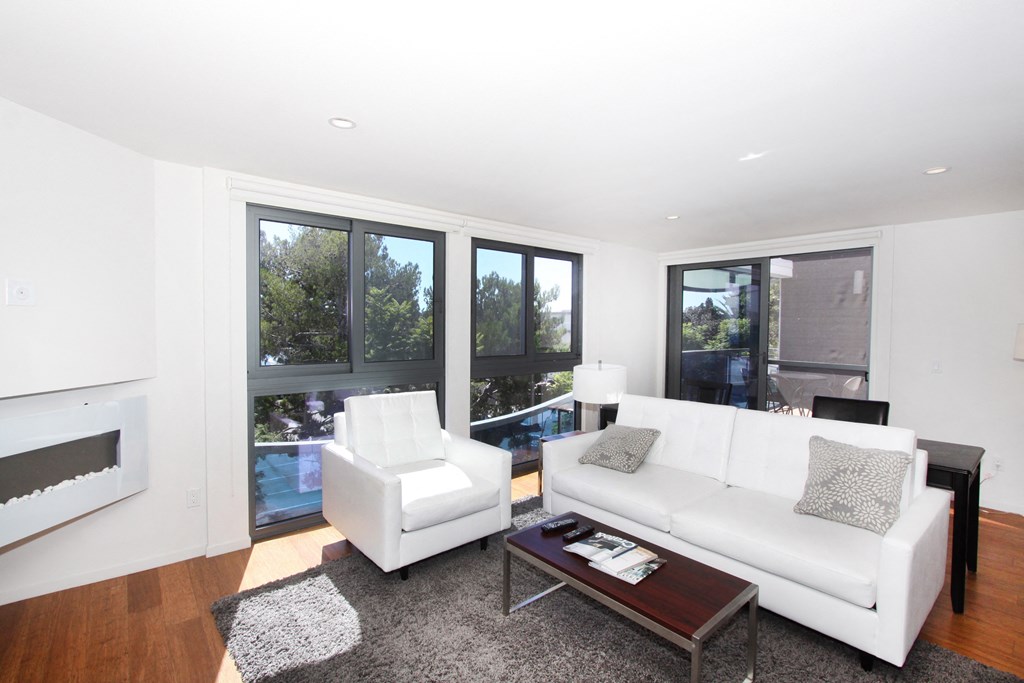 a living room with a white couch and a coffee table