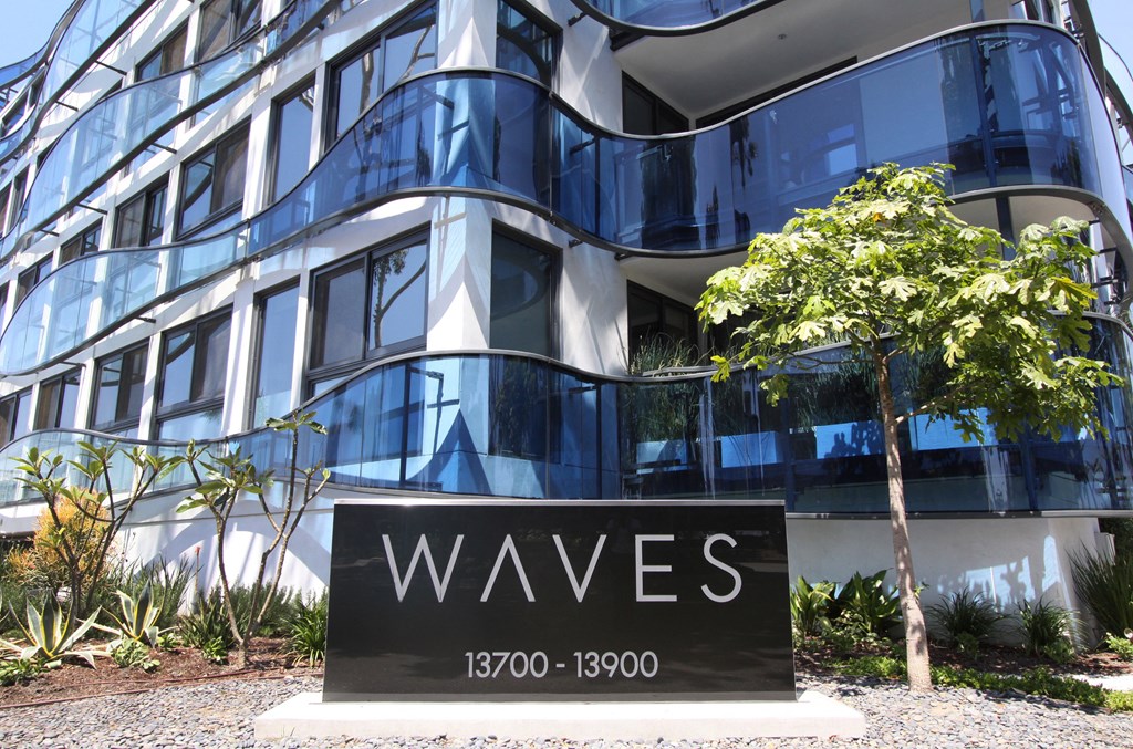 the facade of a building with a sign in front of it