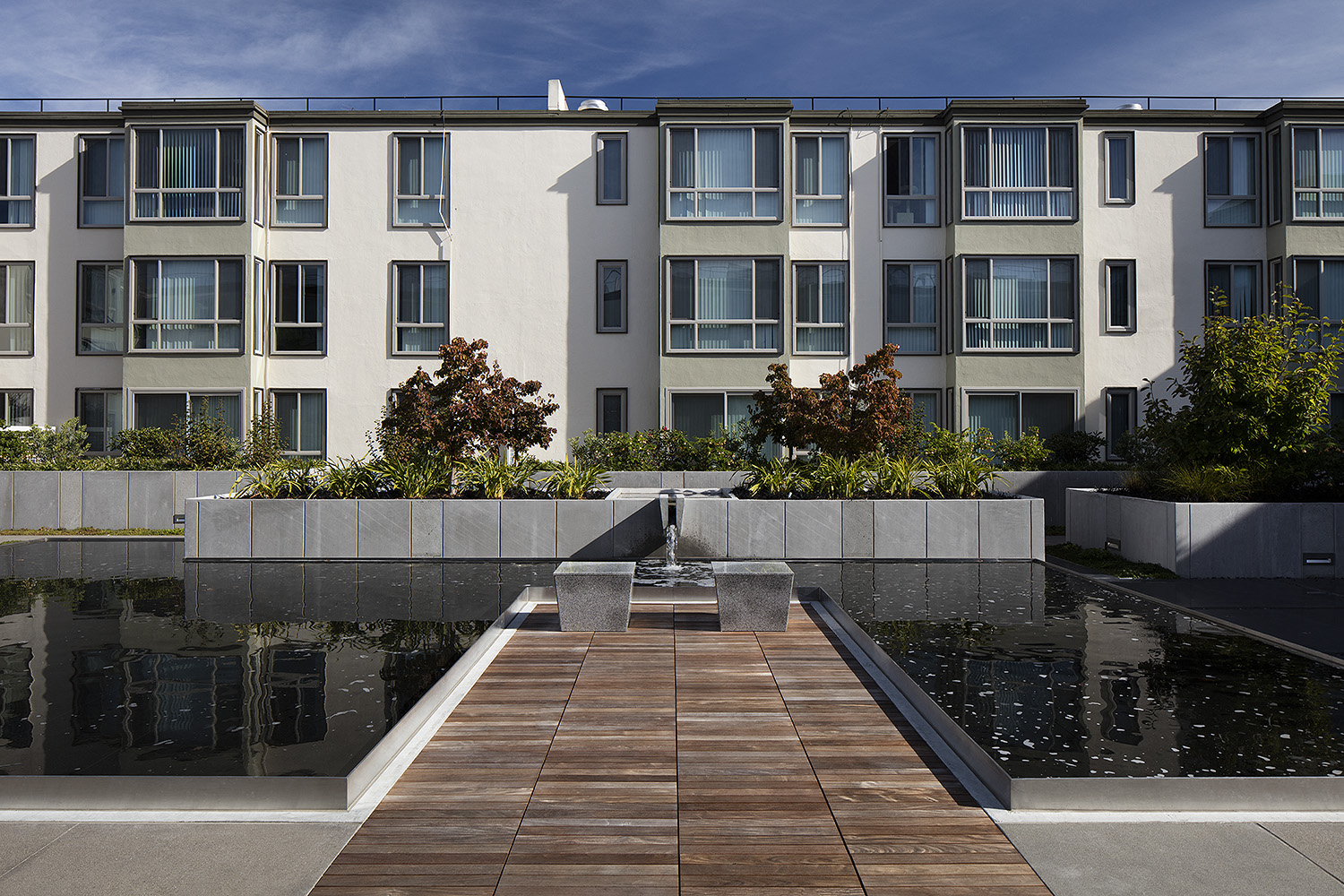 Inner courtyard with a water feature and sitting area.