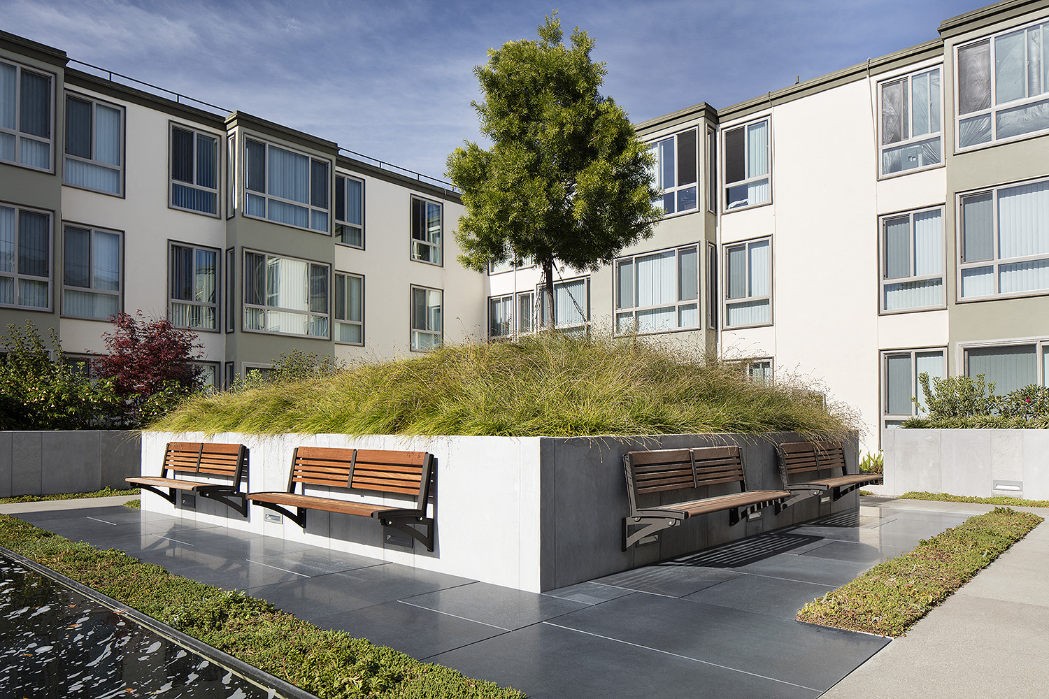Inner courtyard with a water feature and sitting area.
