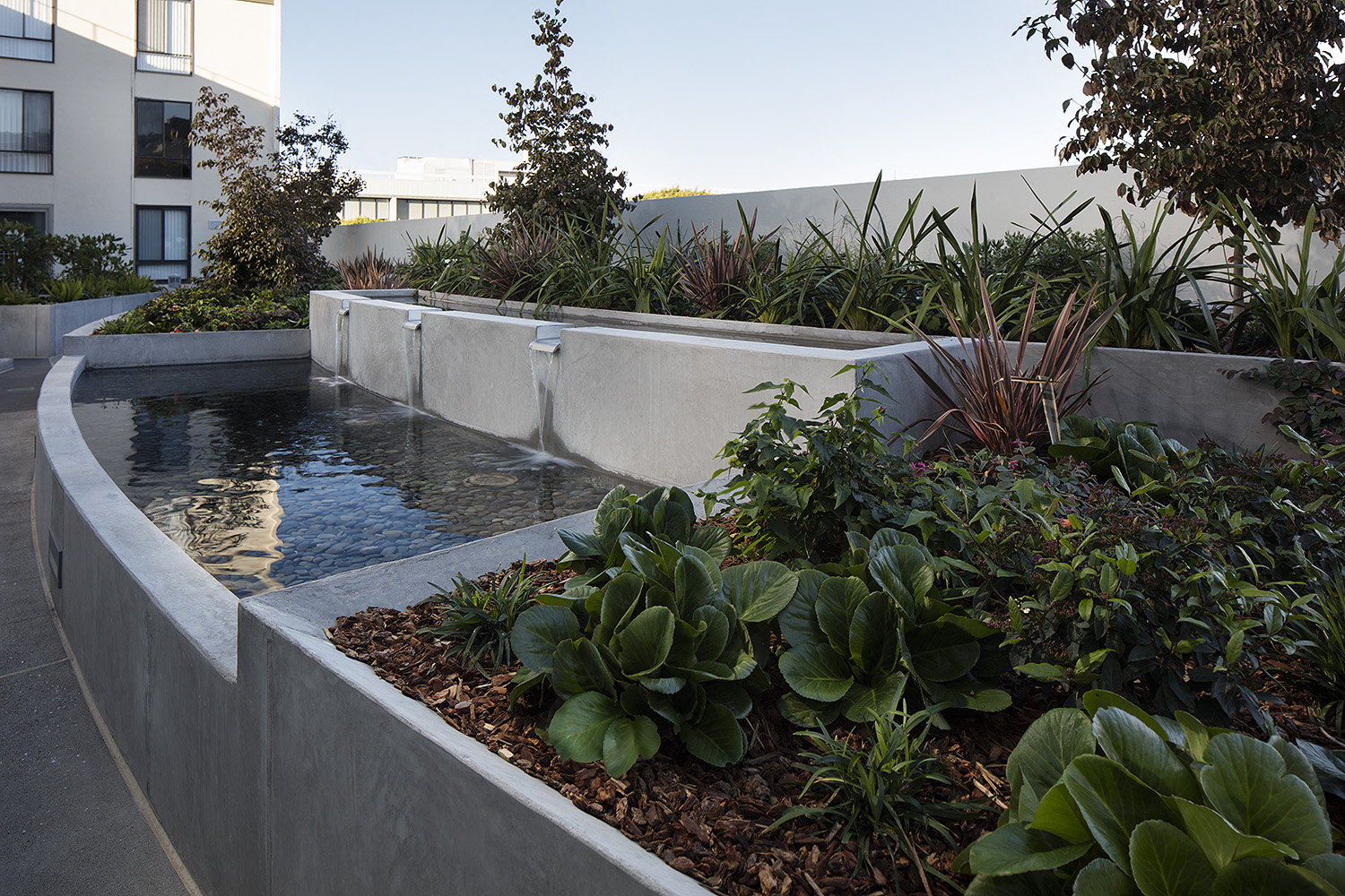 Inner courtyard with a water feature and sitting area.
