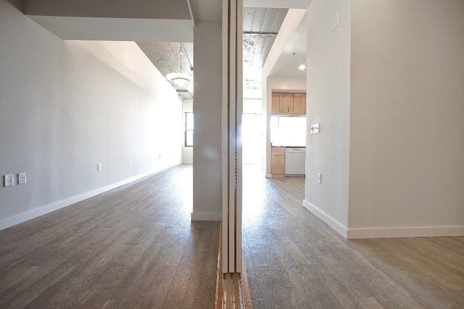 a view of the living room and kitchen from the dining room