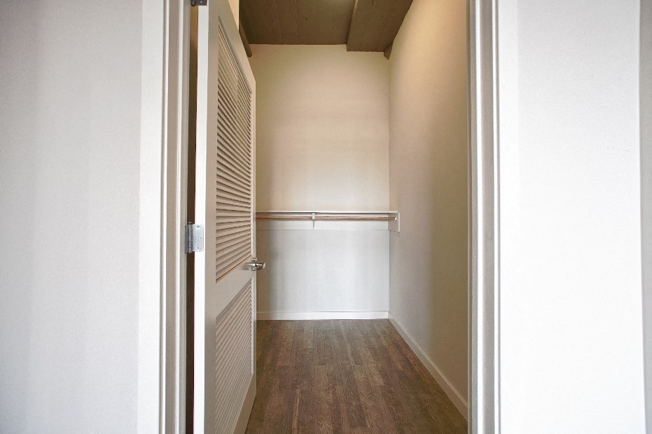 a room with a closet and a door