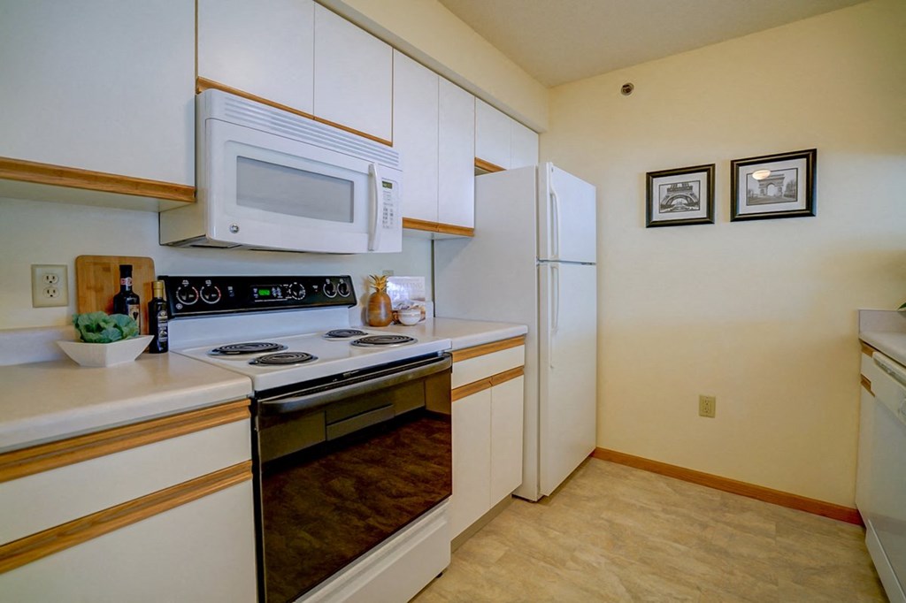 a kitchen with a stove microwave and refrigerator