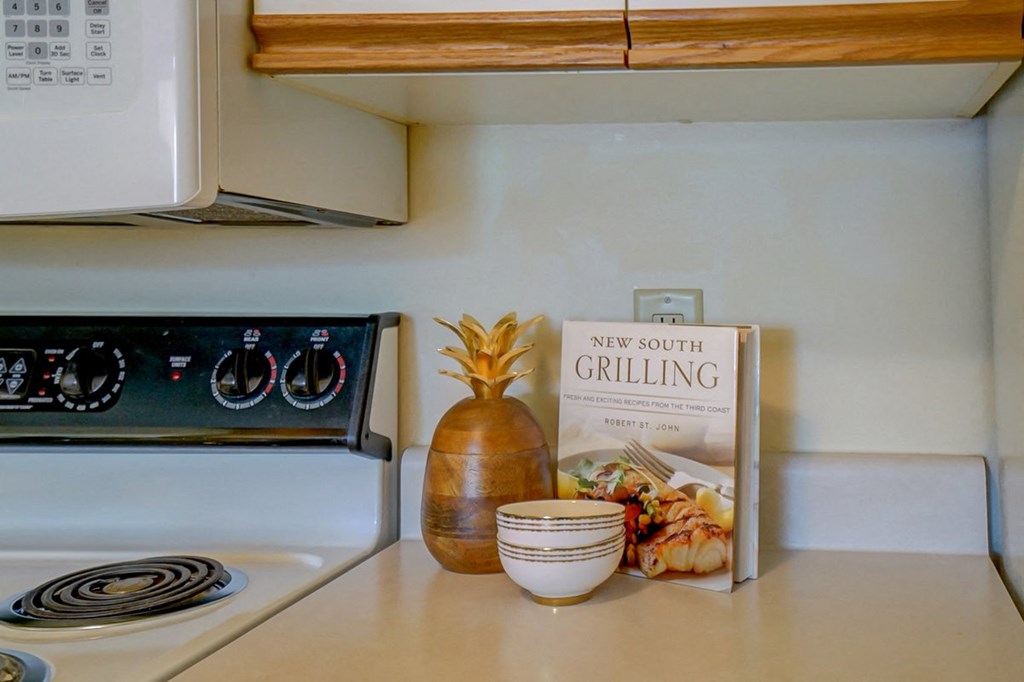 a kitchen counter with a box of new south calling on it