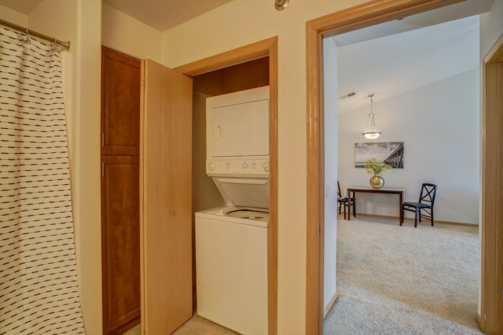 a laundry room with a washer and dryer in a house