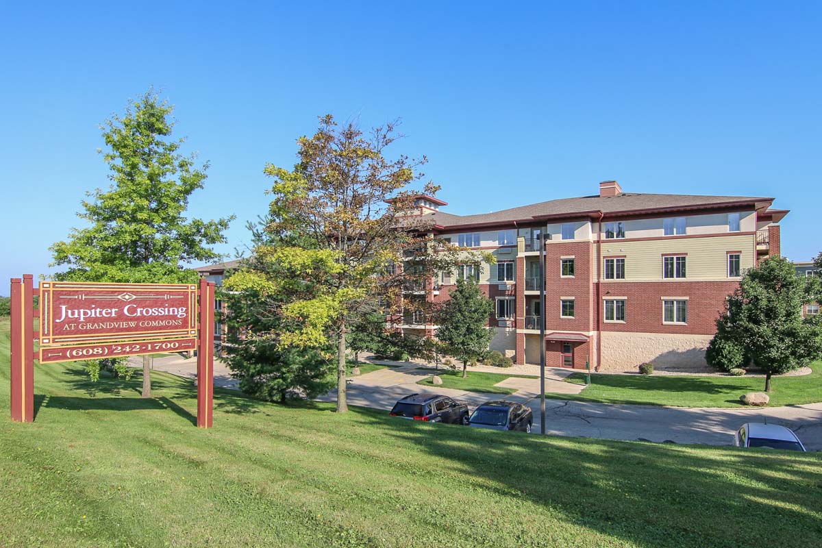 a campus sign in front of a building