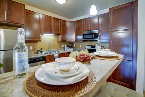 a kitchen with wood cabinets and a counter top