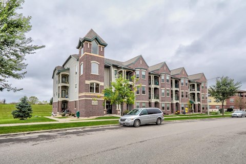 a van parked in front of an apartment building
