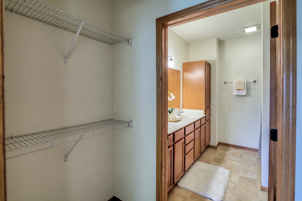 a bathroom with a shower and a sink and a mirror