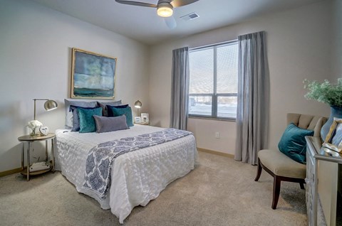 a bedroom with a large bed and a window