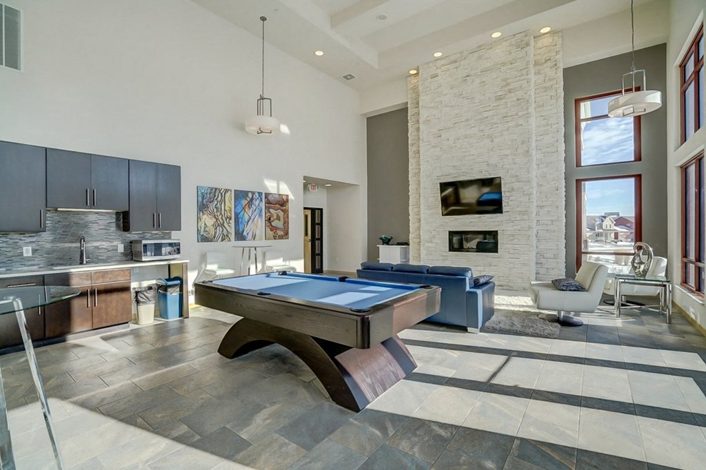 a pool table in the center of a living room