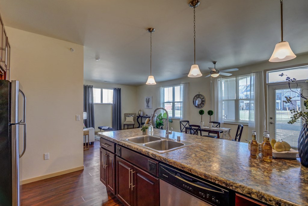 a kitchen with a granite counter top and a sink