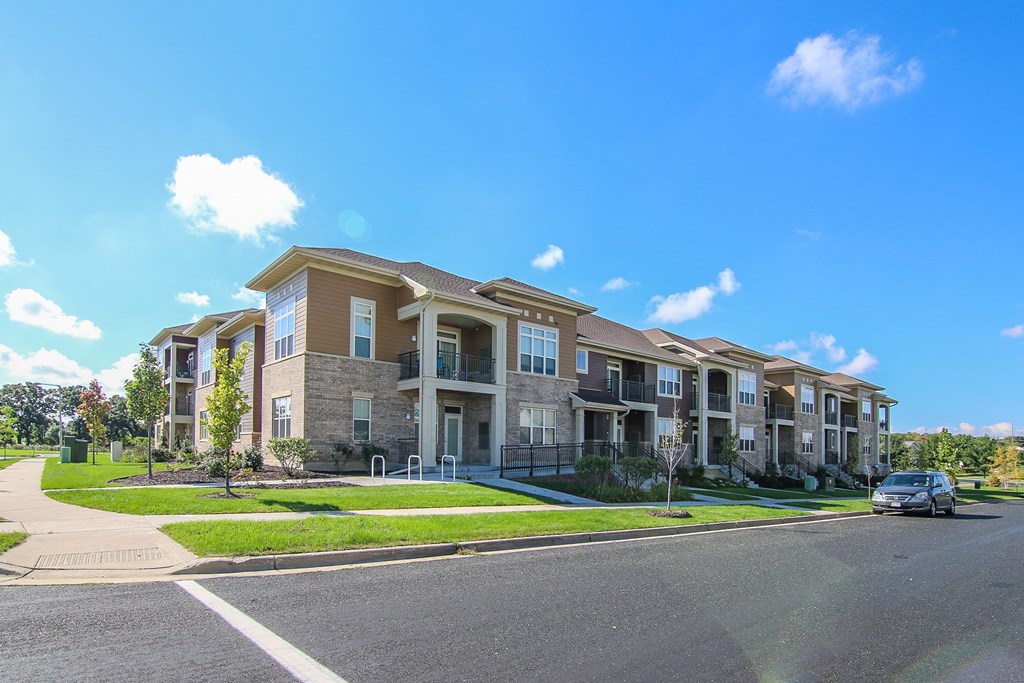 an apartment building on the corner of a street