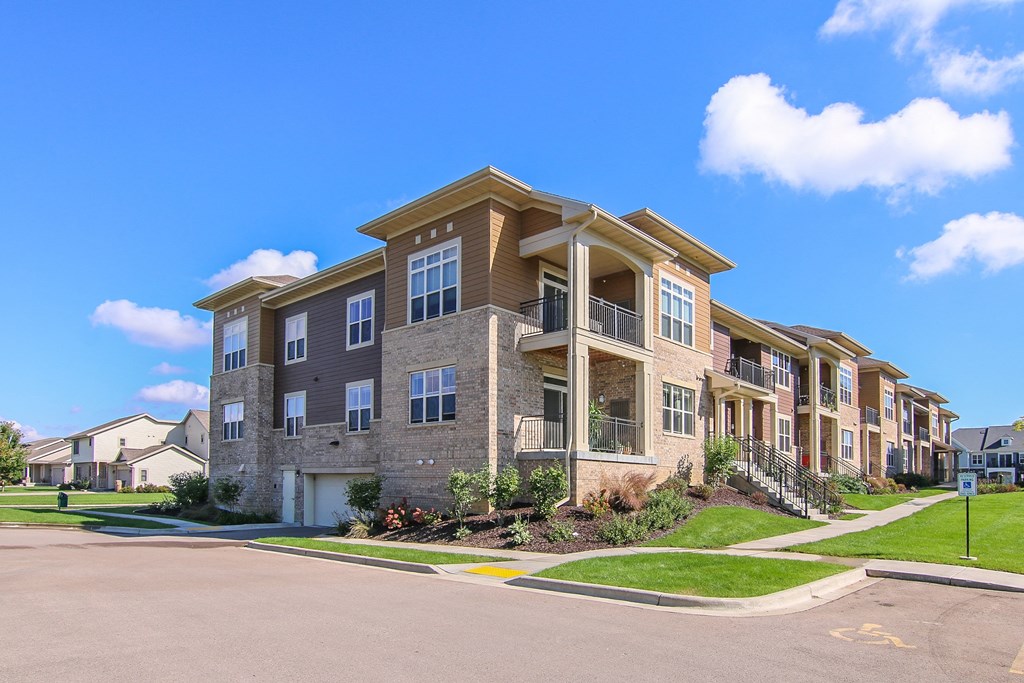 an apartment building on the corner of a street